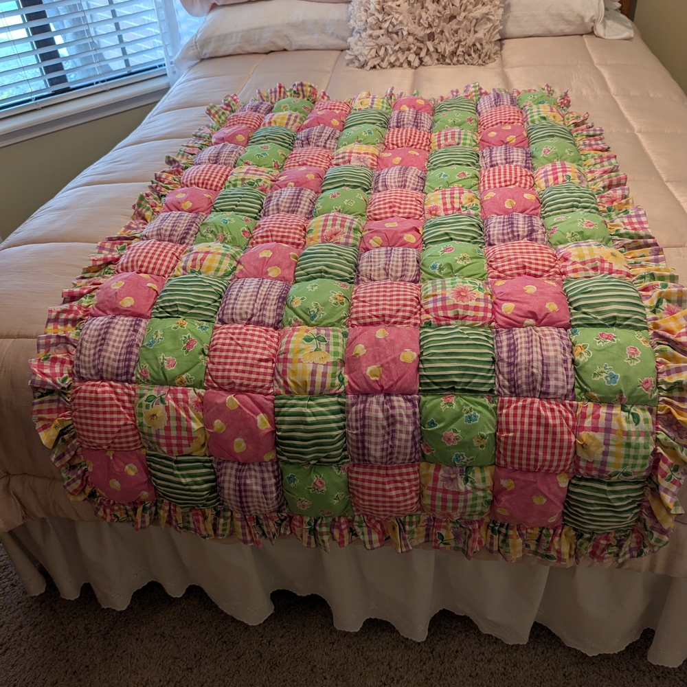 Pink and Green Patchwork Quilt with Ruffled Trim
